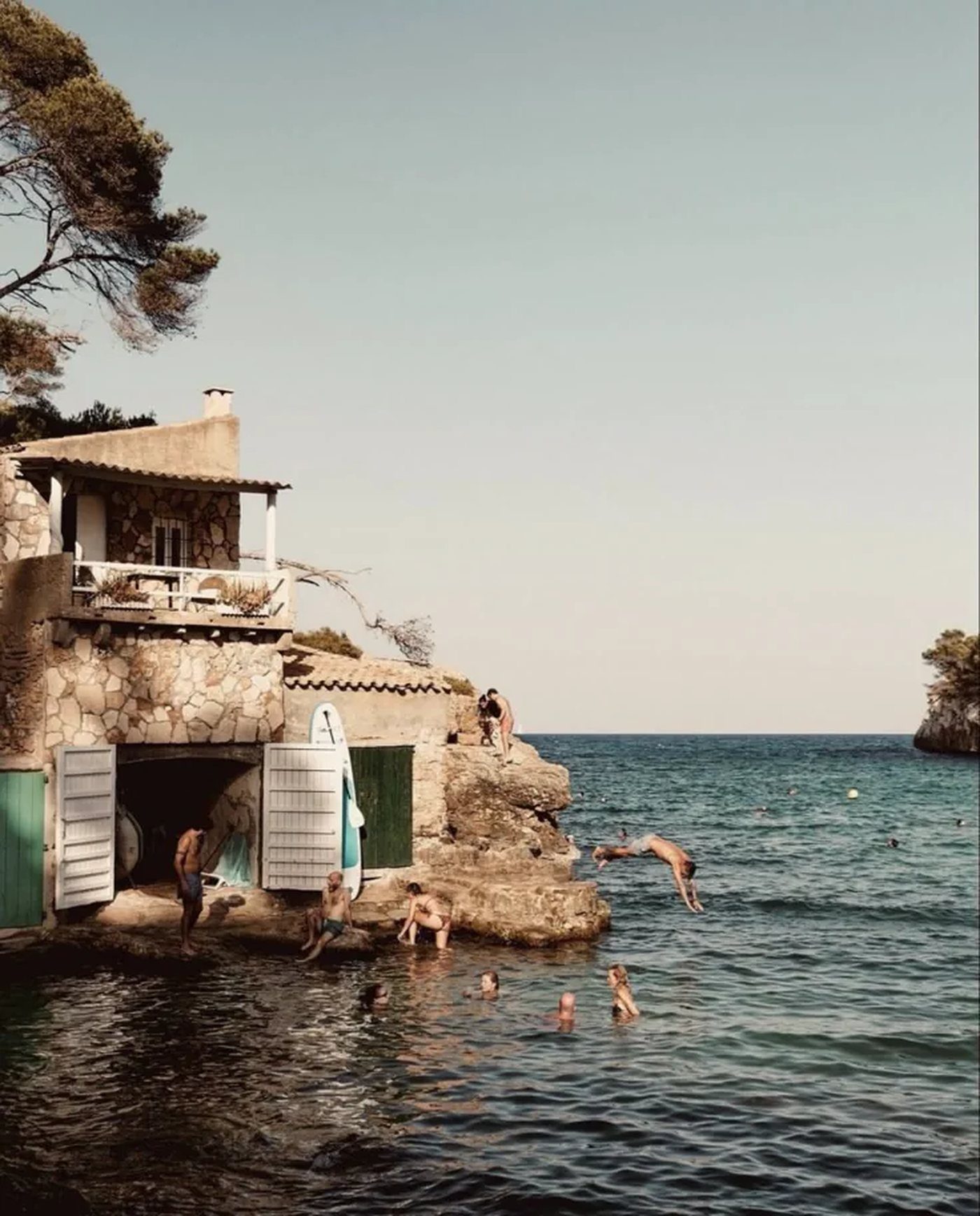 A summer cove where people gather by the water